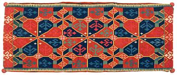 A double interlocked tapestry carriege chusion, 'Three rosettes', c. 113 x 45 cm, Skytts or Oxie district.