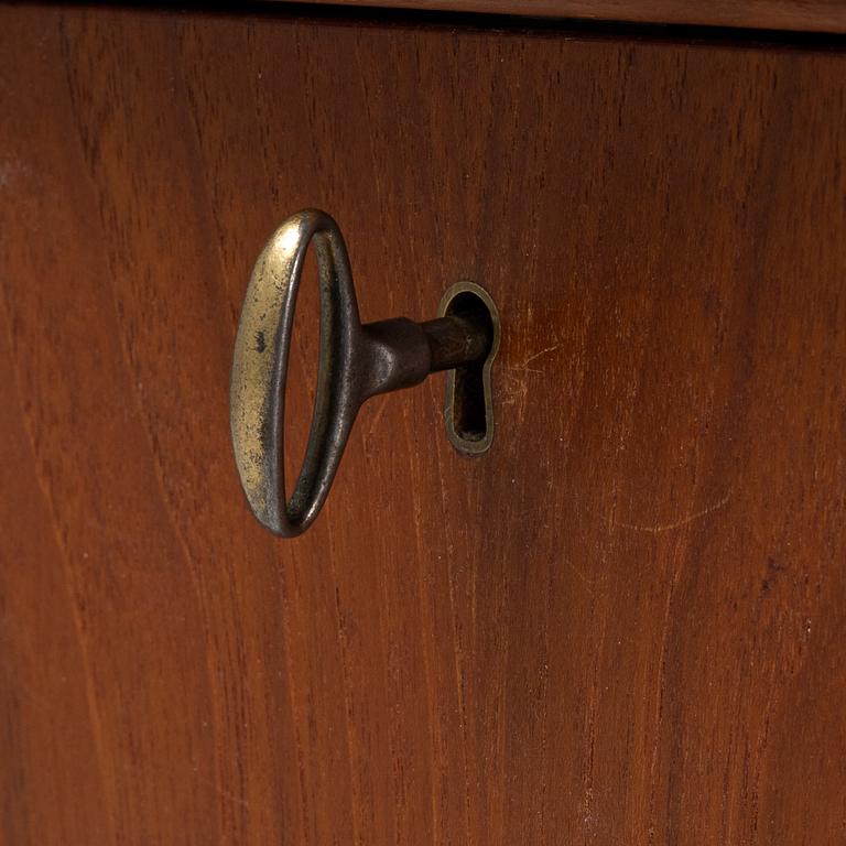 A teak veneered desk, 1950's/60's.