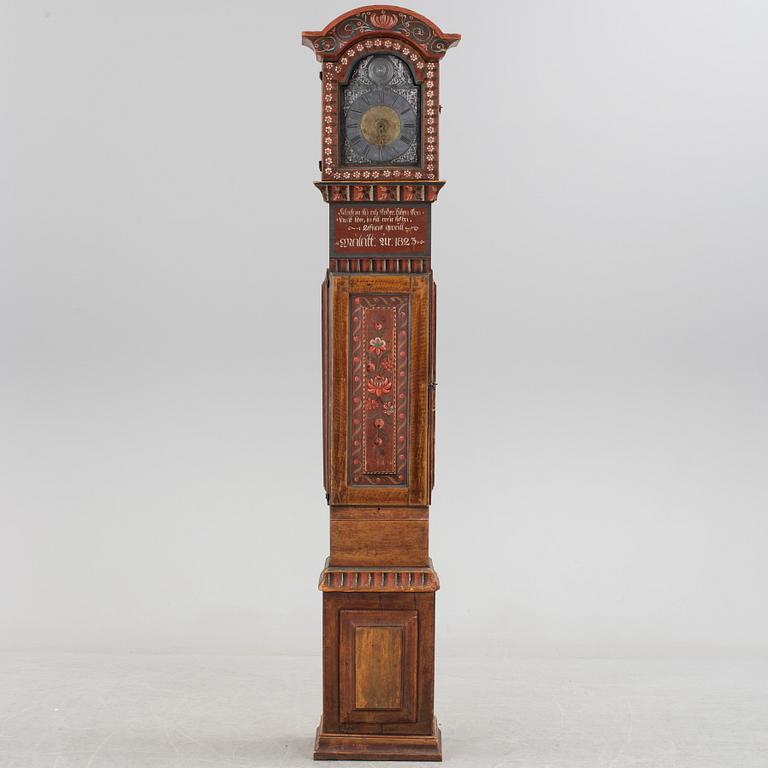 a painted grandfather-clock dated 1823.