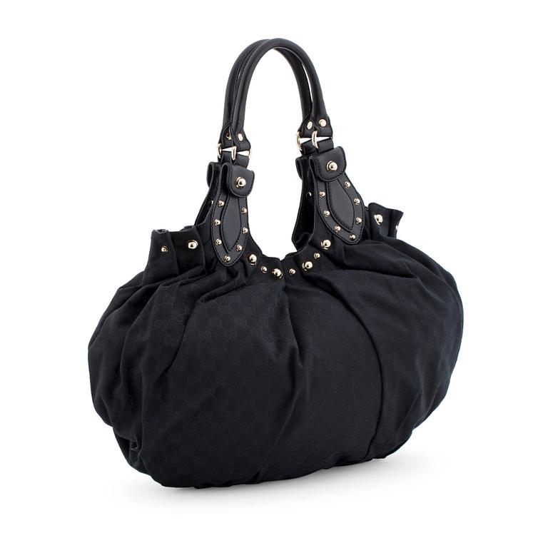 GUCCI, a black monogramed canvas shoulder bag.