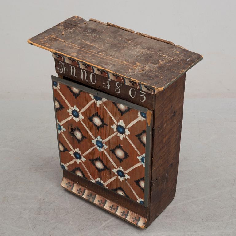 An early 19th century wall cabinet.