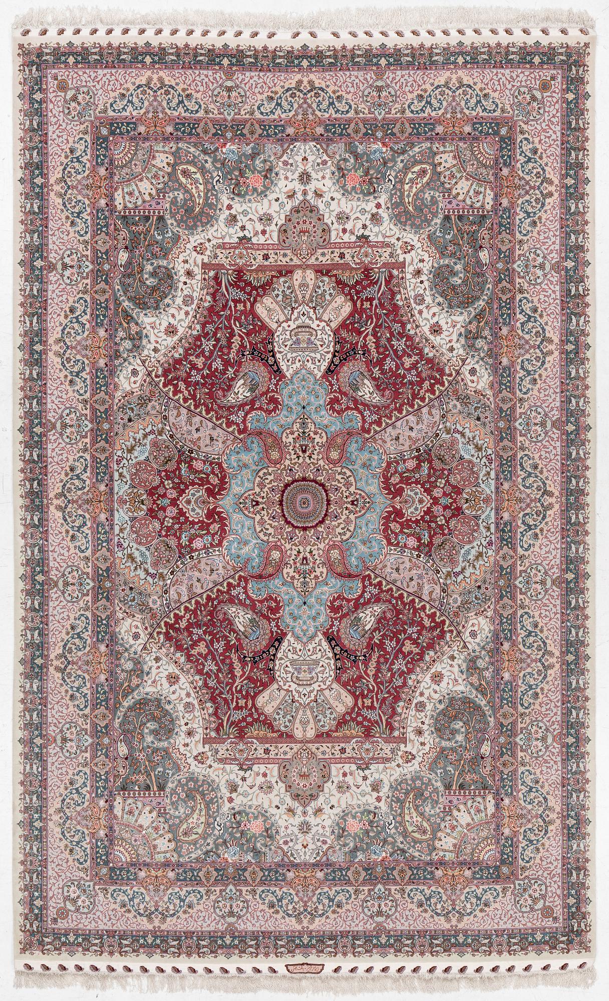 A Tabriz carpet, 210 x 195 cm. signed.