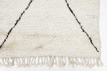 A Moroccan carpet, c. 282 x 150 cm.