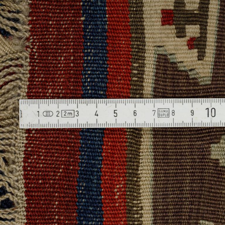 A carpet, a kilim, an antique Anatolian, ca 310-326 x 183,5-192 cm.