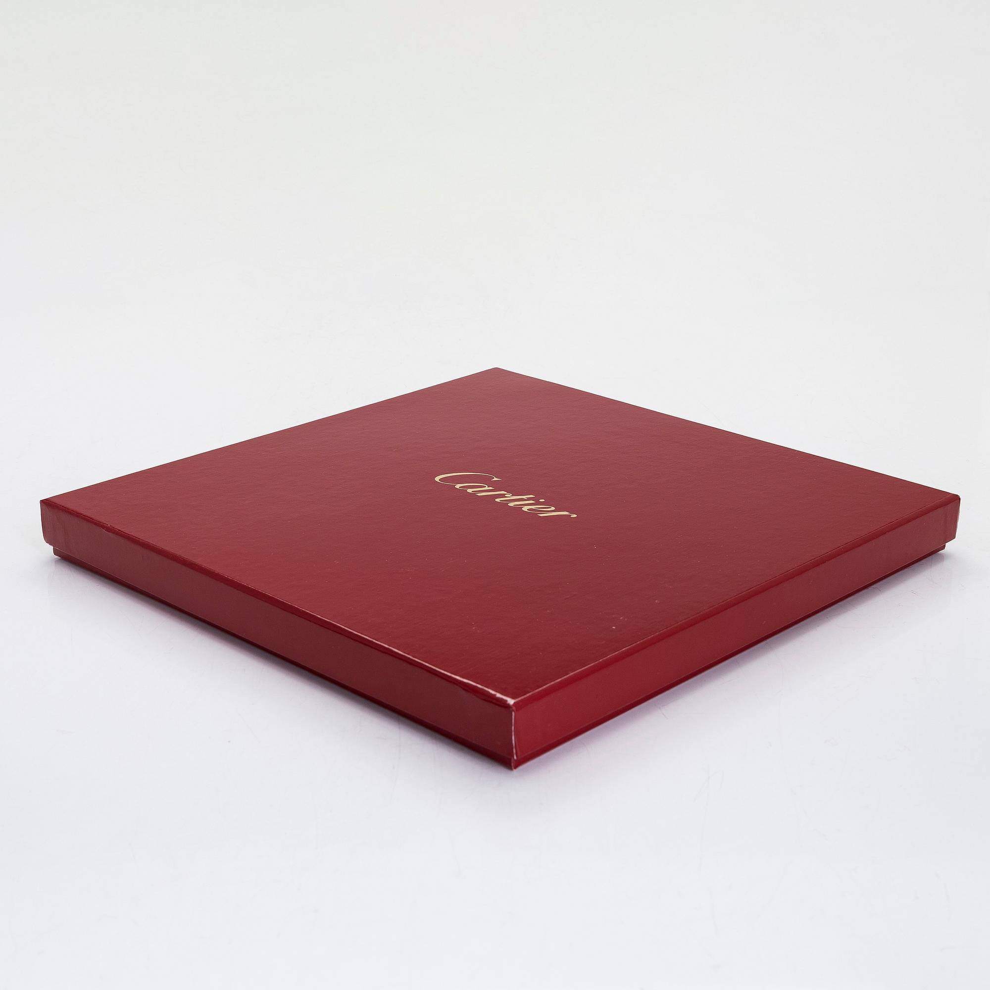 Cartier, two 'La Maison des Must' porcelain cake dishes.