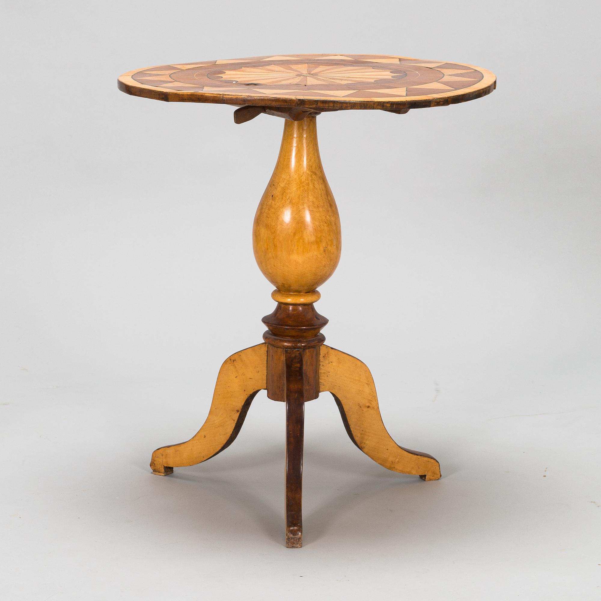 A tilt top table from 19th Century.