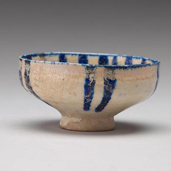 A BOWL, pottery with a white slip and underglaze blue decor, diameter ca 10 cm, Kashan, Persia/Iran early 13th century.