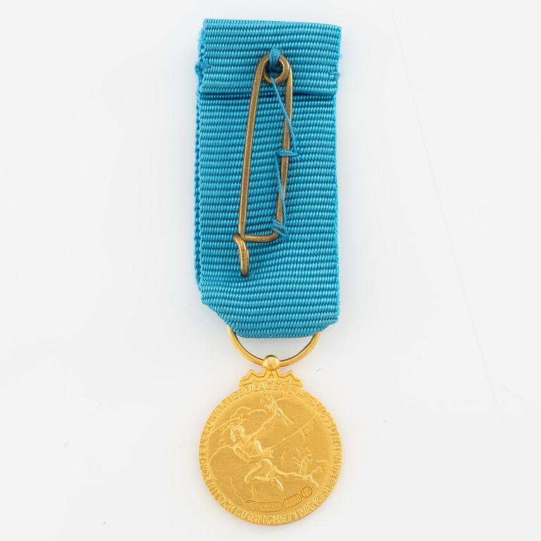 Medal, 14k gold, LM Ericsson, for merit and skill.
