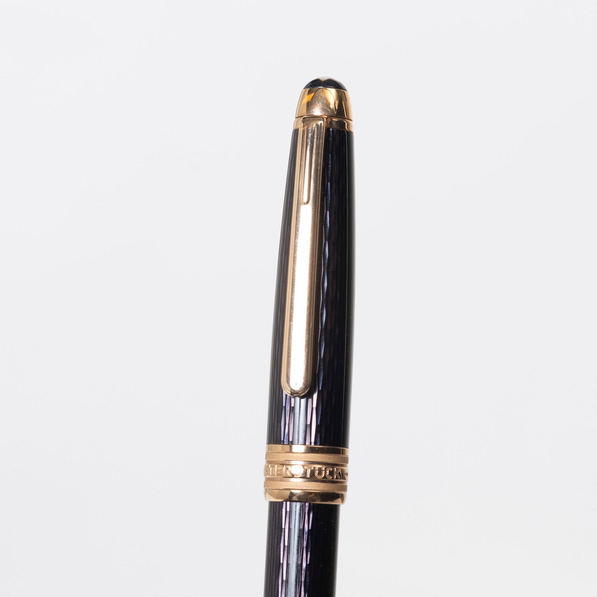 A Mont Blanc Meisterstück 90th Anniversary ed.  ballpoint pen with a case.