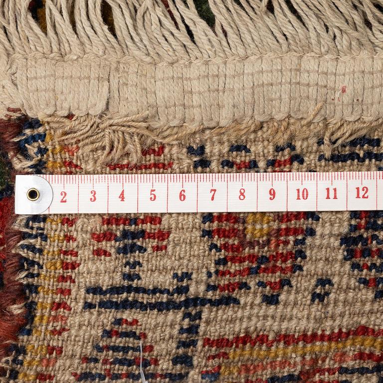 An antique Kurdish runner, Northwest Persia (Iran), c. 560 x 102 cm.