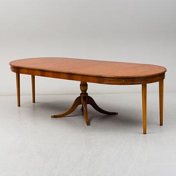 A yew dining table and 8 chairs, second half of the 20th century.