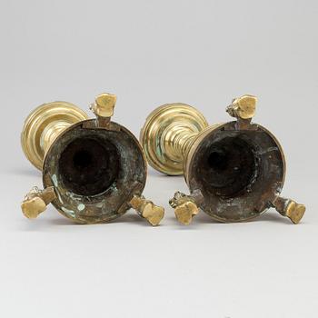 A PAIR OF BRONZE CANDLESTICKS, 18th century or older.