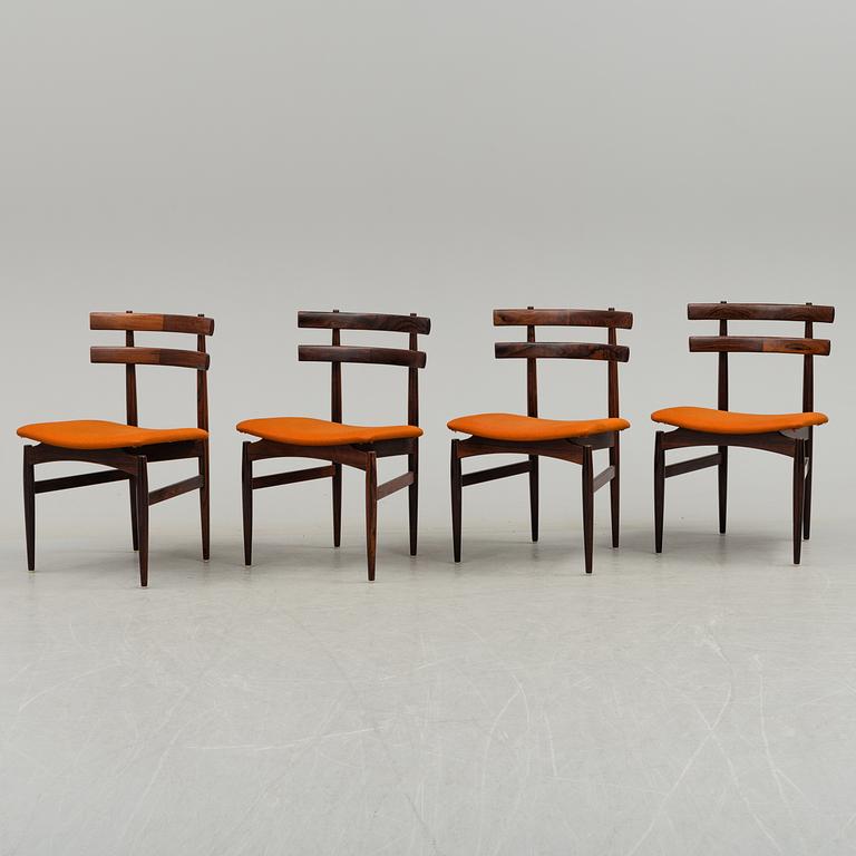 A dining table with four chairs by Poul Hundevad, latter part of 20th century.