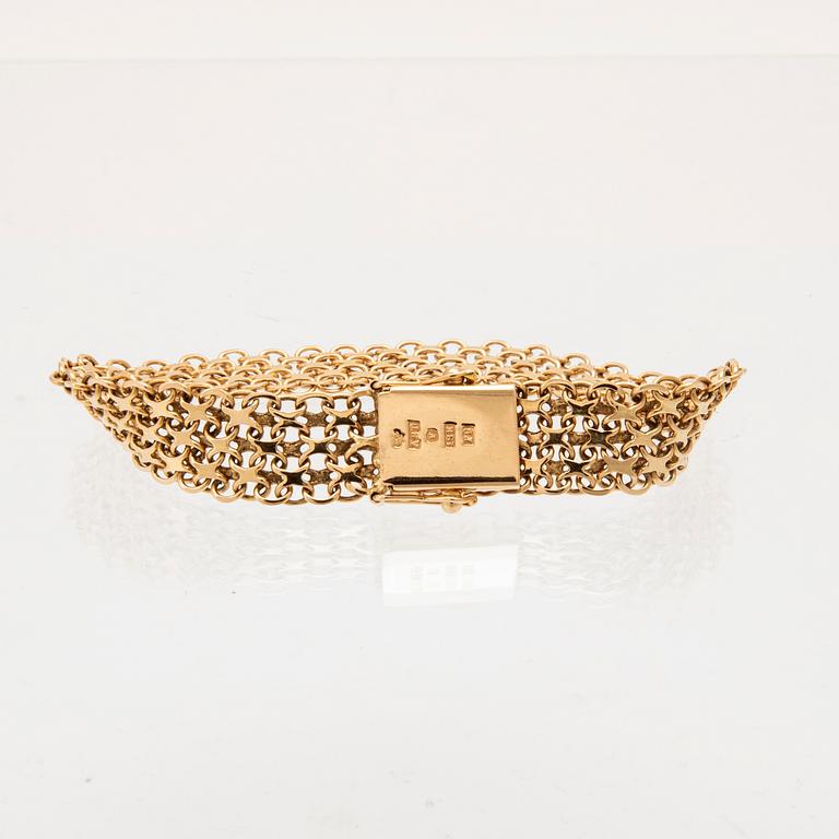 An 18K gold x-link bracelet.