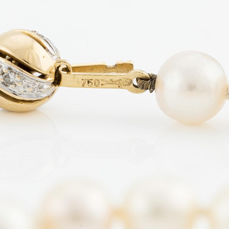 Necklace & bracelet, cultured pearls with 18K gold clasp and small diamonds.