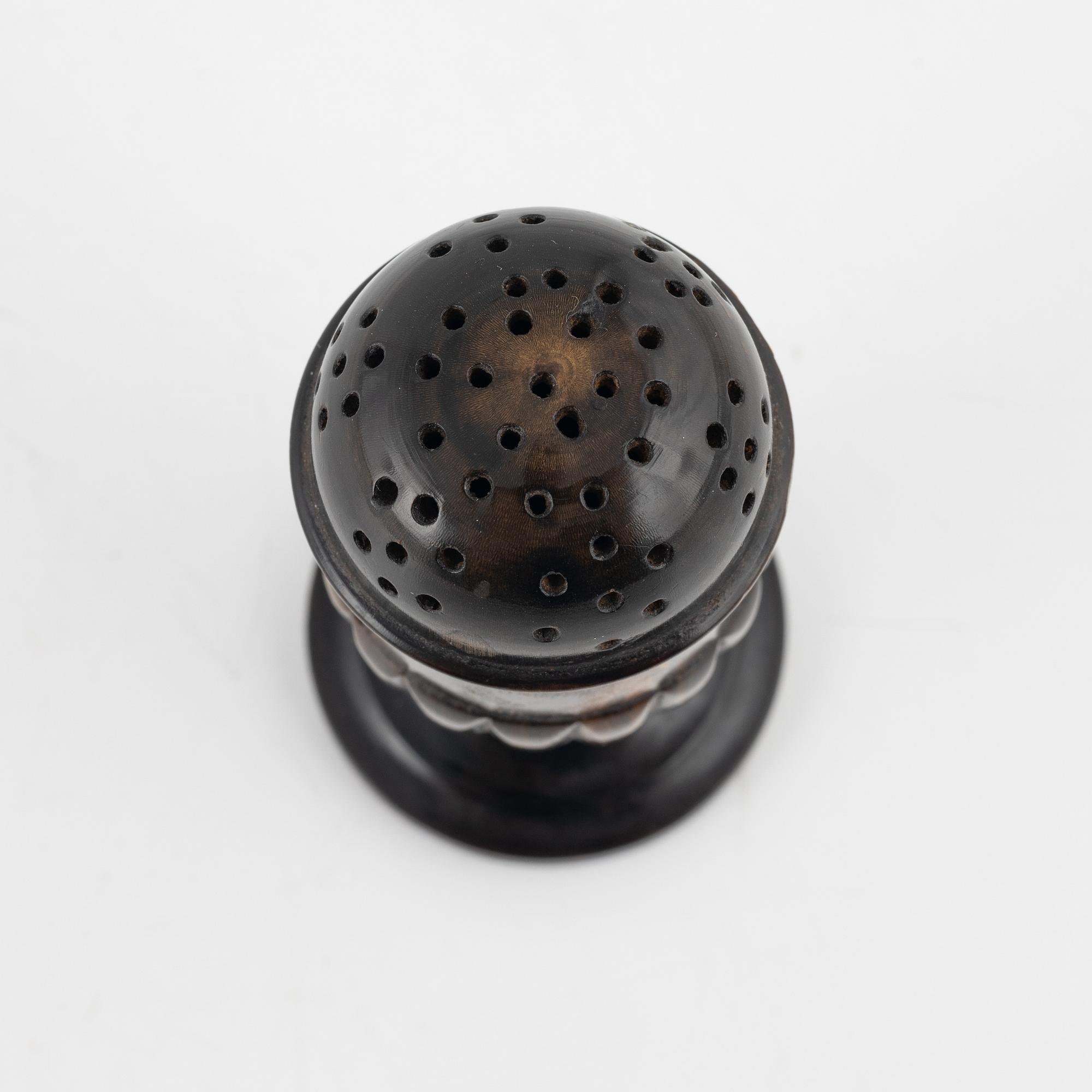 A 18th Century horn saltshaker.