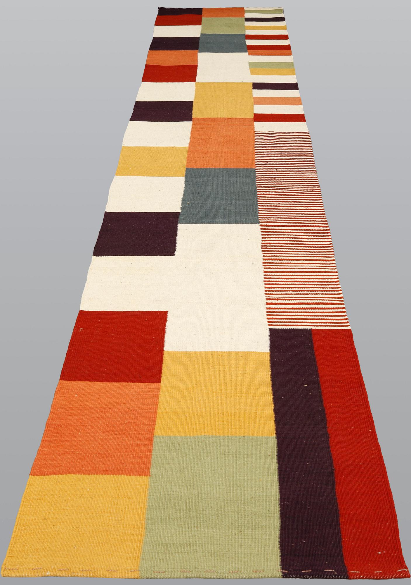 A runner, flat weave, ca 488 x 82 cm.