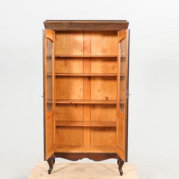A 1920s oak display cabinet.