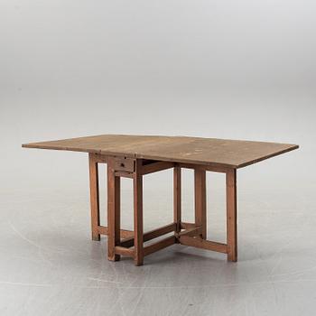 A 19th century painted gate leg table.