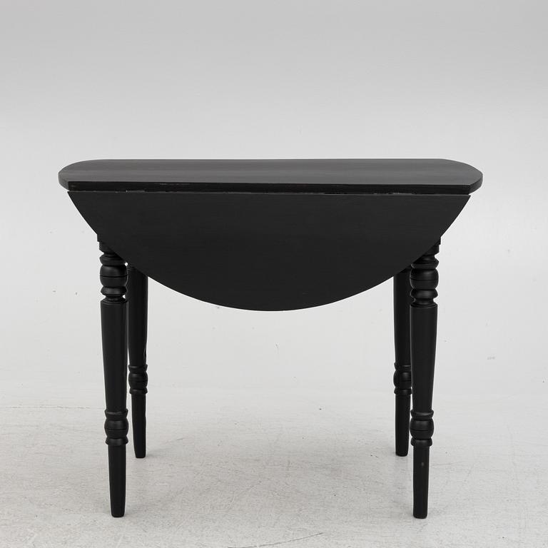 A drop-leaf table, late 19th century.