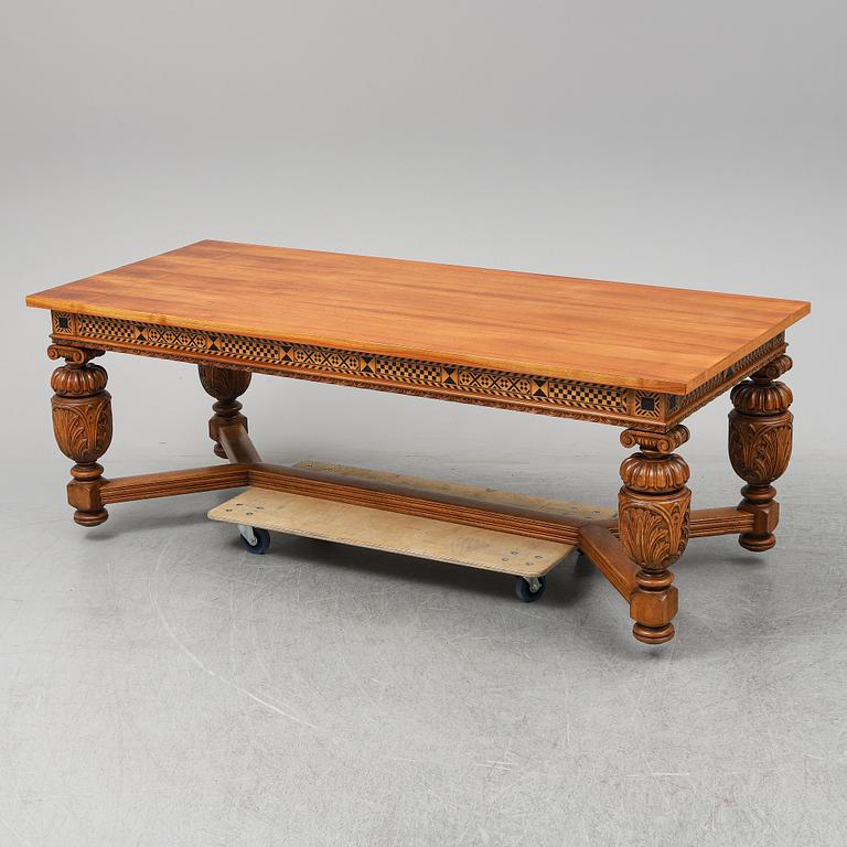 A 20th century baroque-style mahogany table.