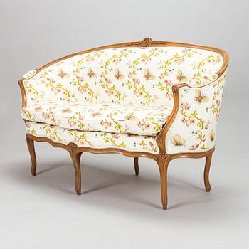 A French, mid-18th-century Louis XV sofa.