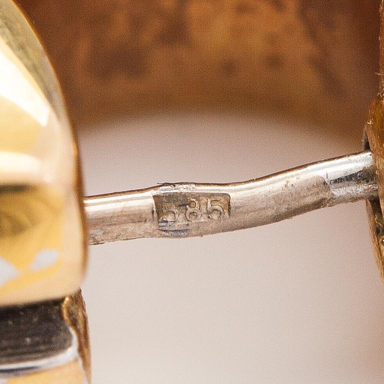 A pair of 14K gold earrings.