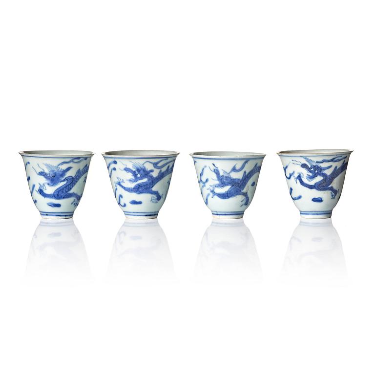 A set of four blue and white dragon wine cups, 'Hatcher Cargo', 17th century.