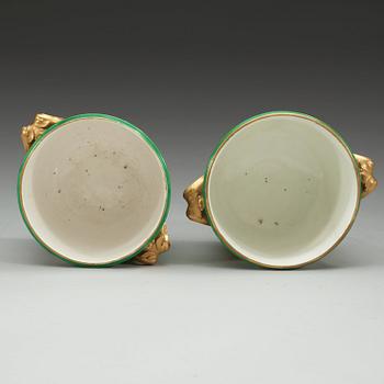 A pair of green Sèvres wine coolers, 18th Century. Possibly decorated later.