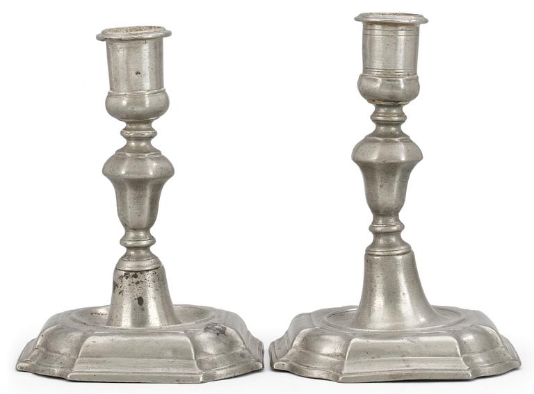 Two matched pewter candlesticks by D. and E. Björkman, Stockholm 1746 and 1754.