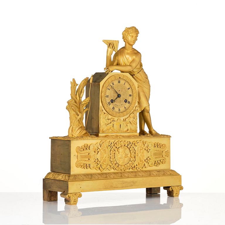 A French Empire ormolu and patinated bronze mantel clock, Paris, early 19th century.