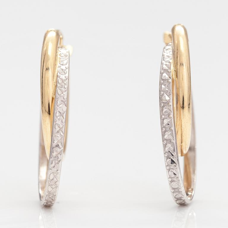 A pair of 14K gold earrings.