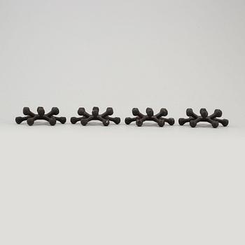 JENS QUISTGAARD, four cast iron candlesticks from Dansk Designs, Denmark, 1960's.