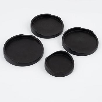 Magnus Ek, a set of four ebony coasters for Oaxen Krog.