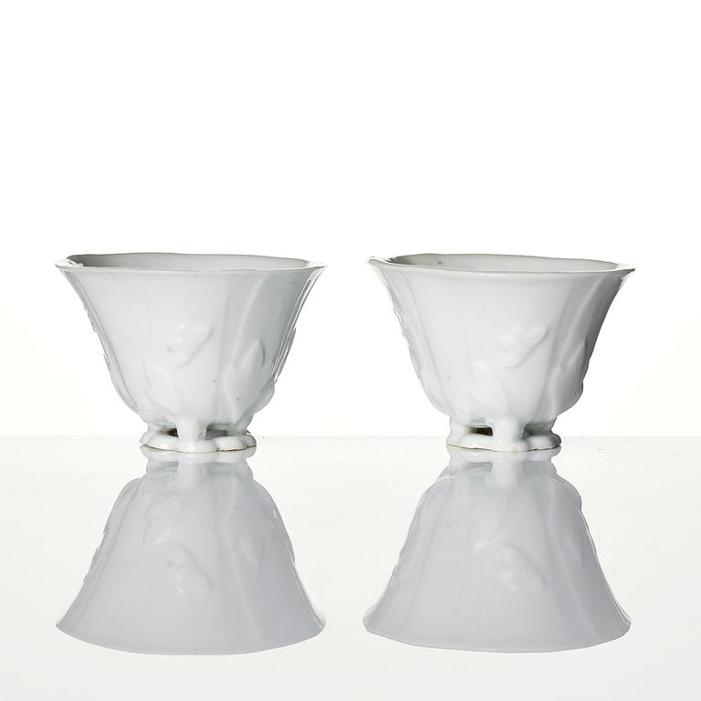 A pair of blanc de chine libation cups, Qing dynasty, 19th century.
