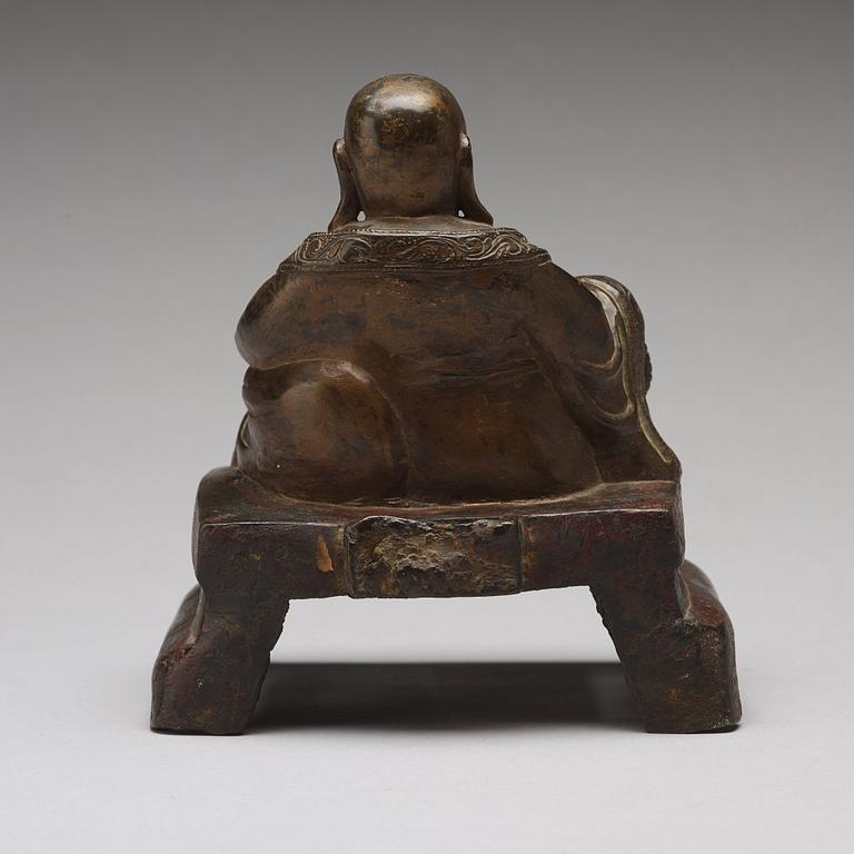 A setated bronze figure of Buddai, Qing dynasty (1664-1912).