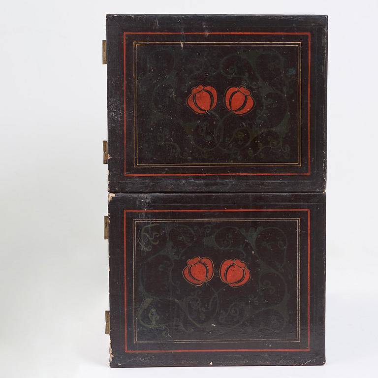 A lacquered cabinet, in two sections, Qing dynasty, 19th Century.