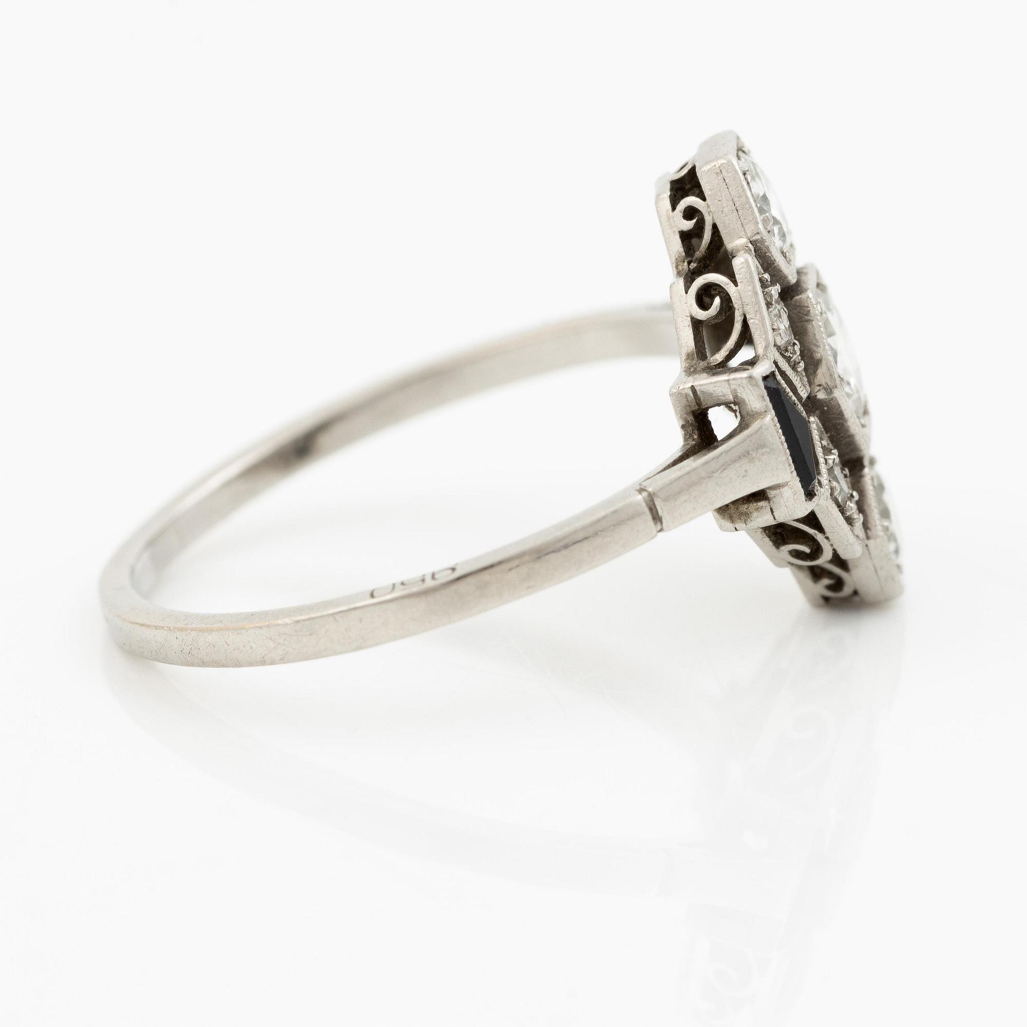 A platinum ring set with round brilliant-cut diamonds and sapphires, Art Déco.