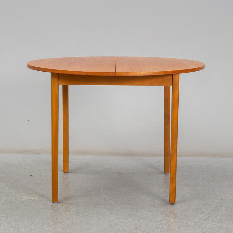 A second half of the 20th century teak veneered dining table.