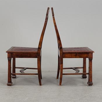 A late 19th century dining table with ten chairs and five extension leaves.