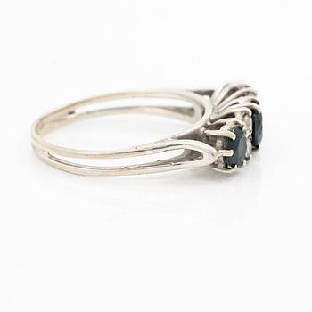 Ring, 18K white gold, set with three sapphires and single-cut diamonds.