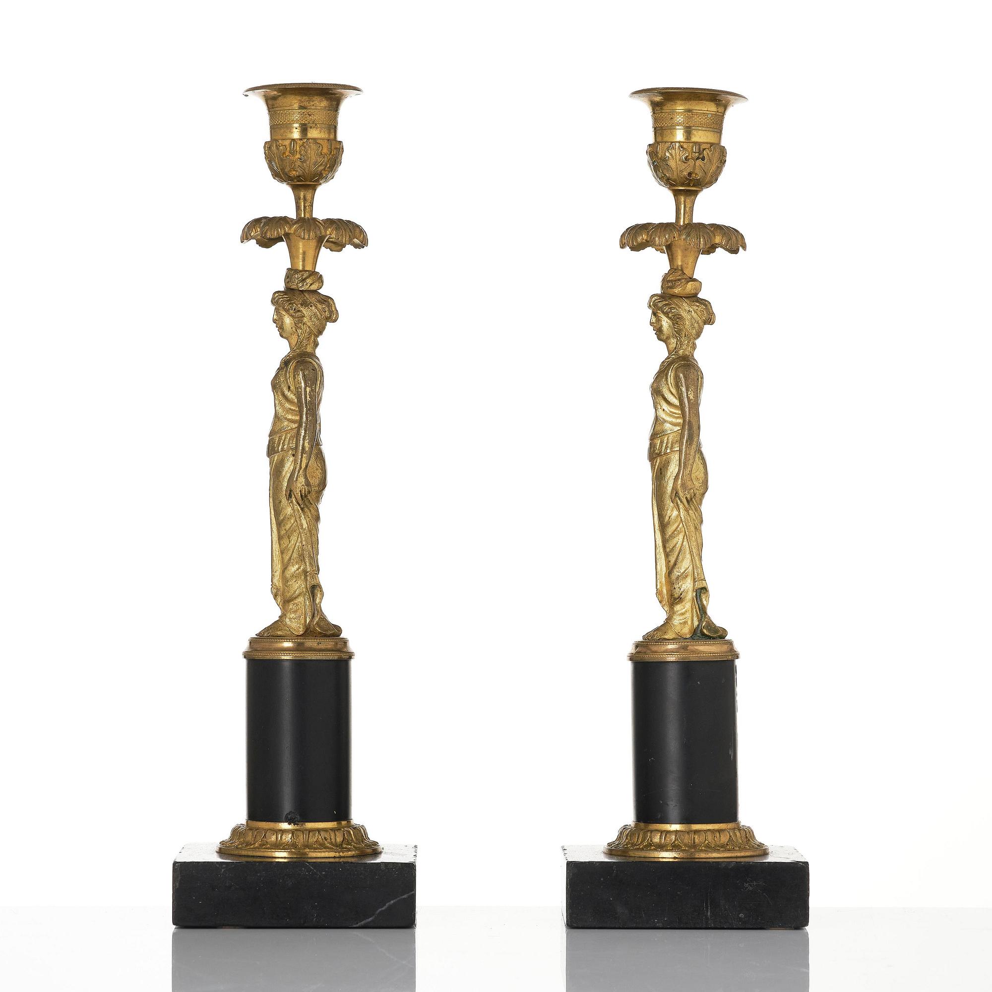 A pair of late Gustavian marble and ormolu candlesticks attributed to F. L. Rung (1758-1837).