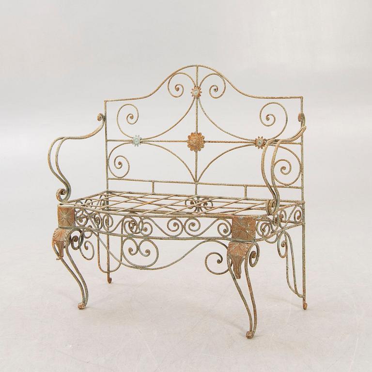 A wrought iron garden sofa, mid 20th century.