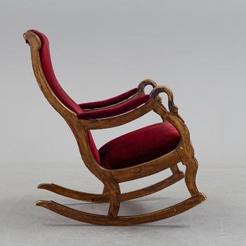 A 19th century swan arm rocking chair.