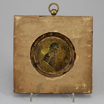 A gilt brass medalion, early 19th century.