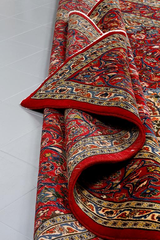 A Semnan rug, signed, 388 x285 cm.