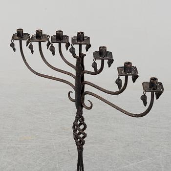 A wrought iron Swedish folk art candle holder.