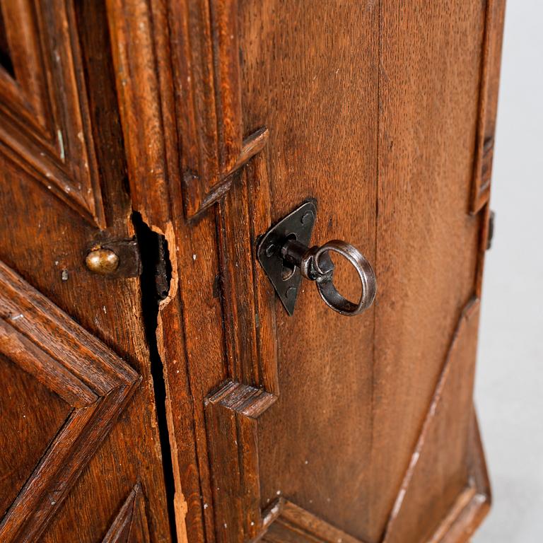 A 18th century corner cabinet.