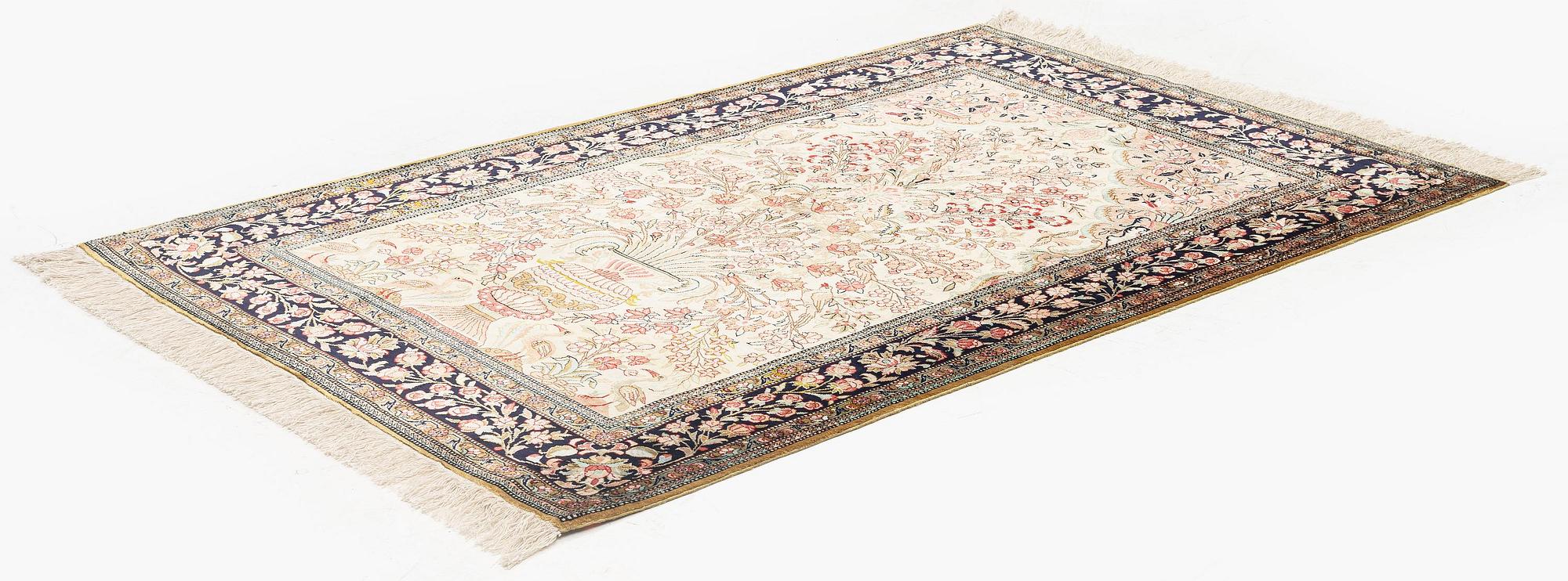 A silk Qum rug, c. 156 x 101 cm.