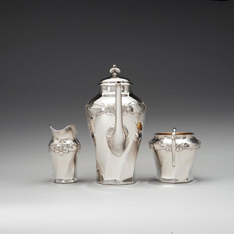 A C.G. Hallberg three pieces Art Nouveau silver coffee service, Stockholm 1904-1905.